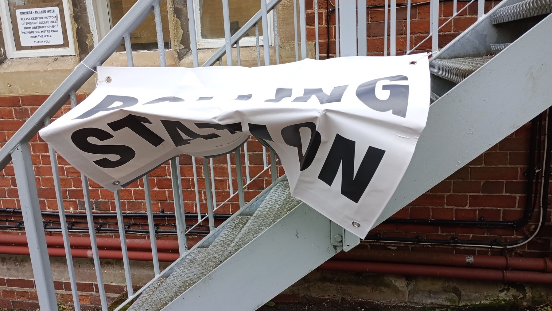 crumpled polling station banner